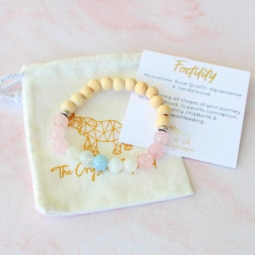 fertility bracelet with moonstone, rose quartz and sandalwood.