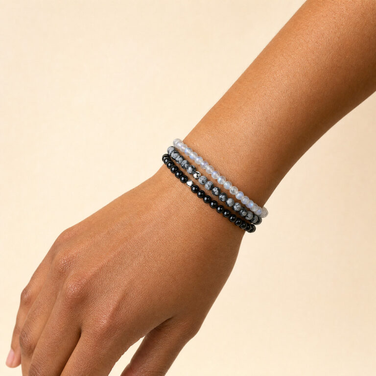 The Protect Your Energy bracelet set worn stacked on a wrist